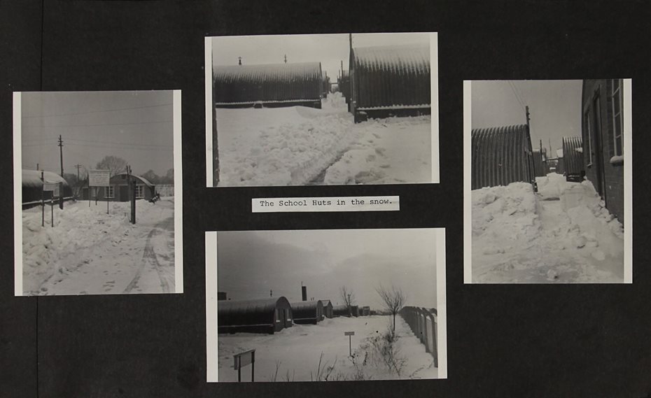 Scrapbook page with four black and white photographs of heavy snow fall around Nissen huts.
